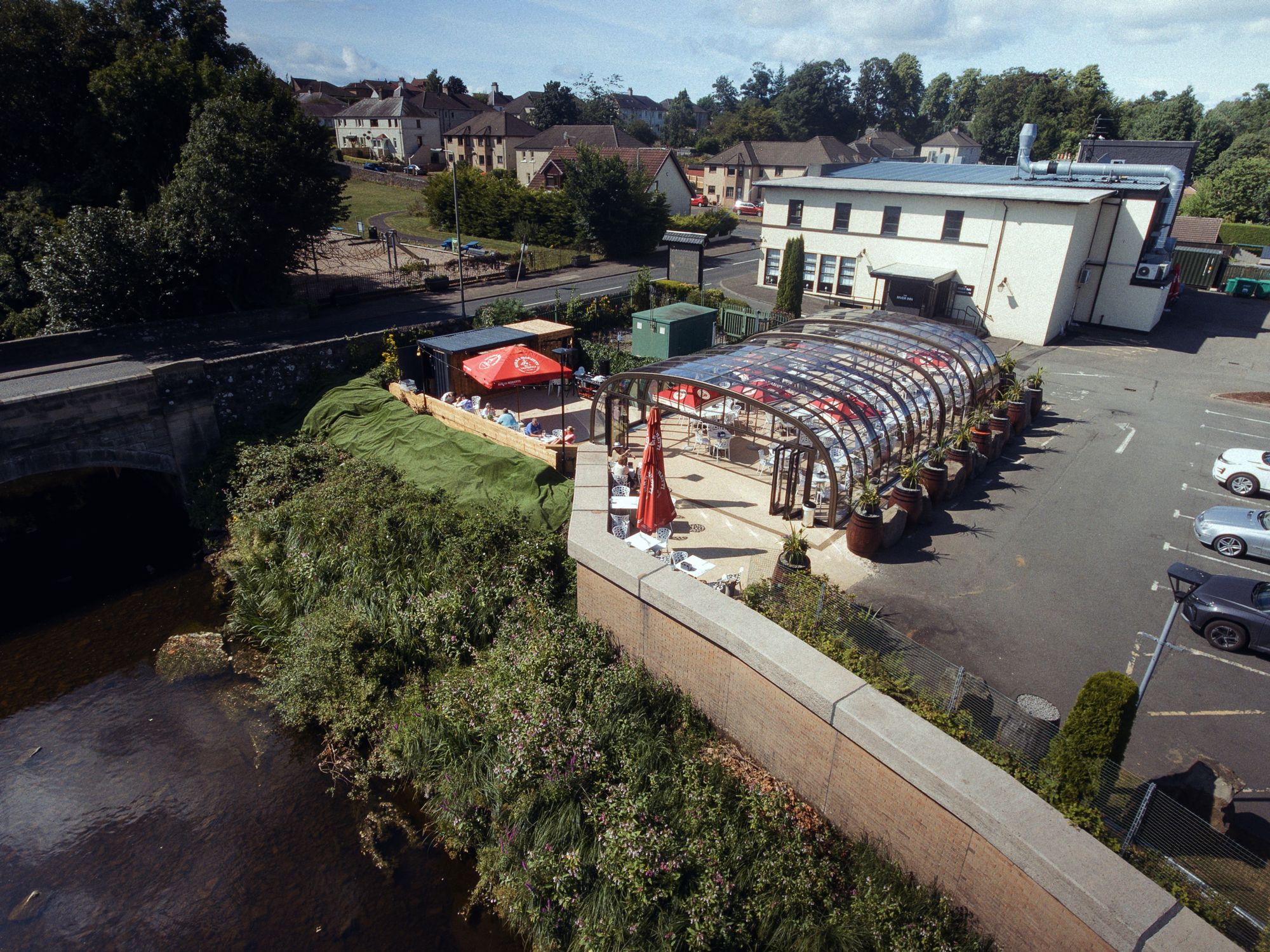 The River Inn glasshouse beside the river