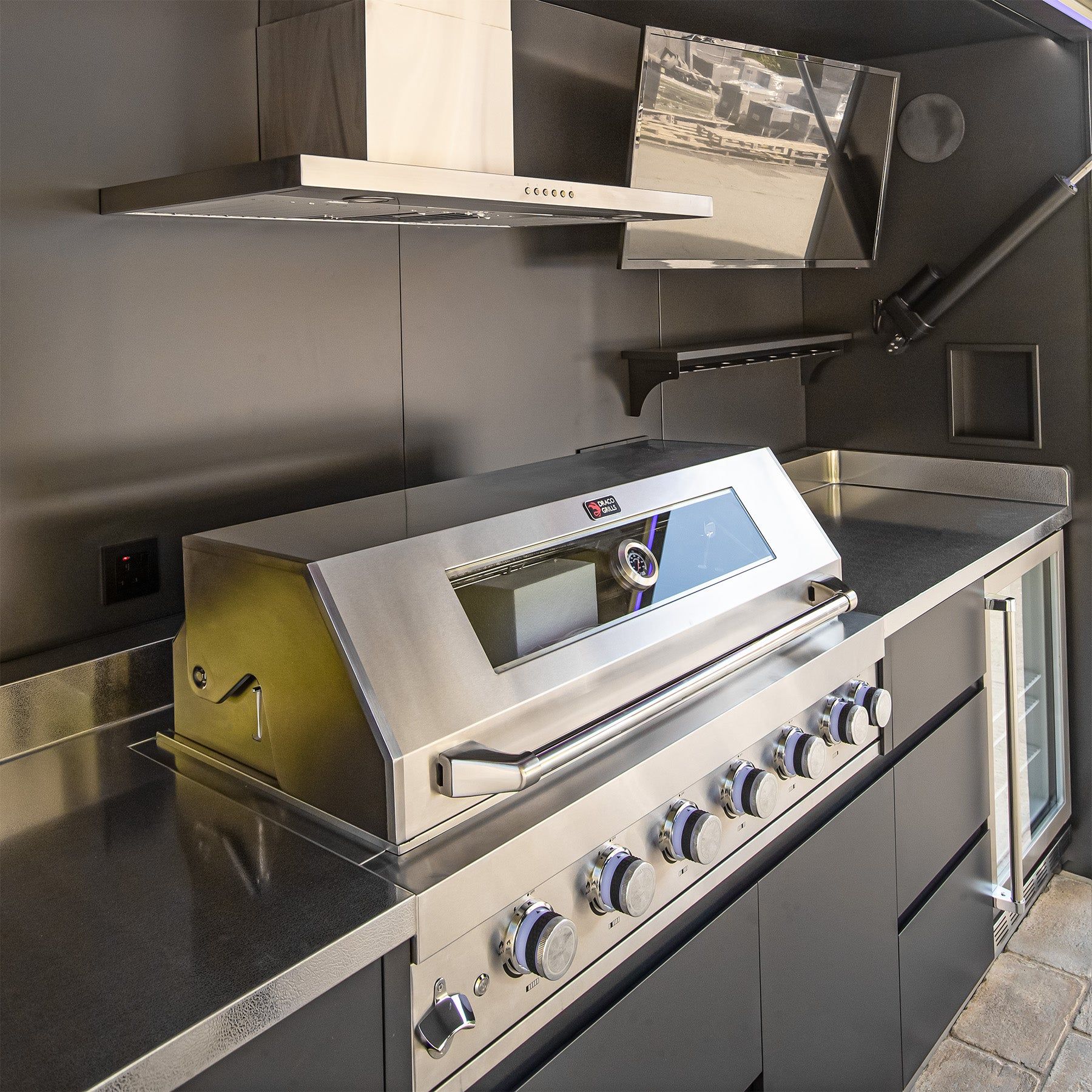 The six burner grill and stainless worktop inside an outdoor kitchen cube, close in (supplier photograph)