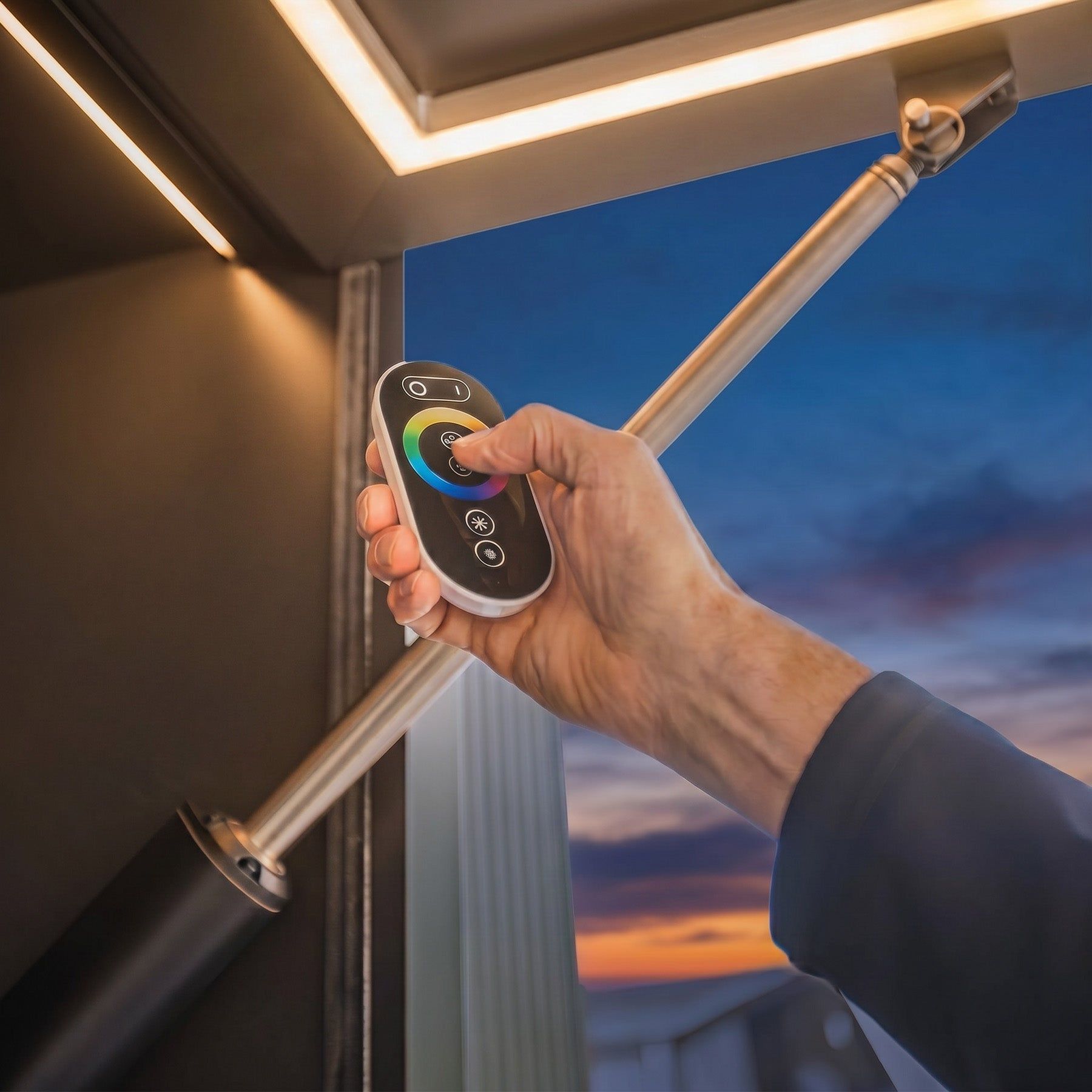 The strip light along the underside of the cube's door lit warm white at dusk, the remote in hand (supplier photograph)